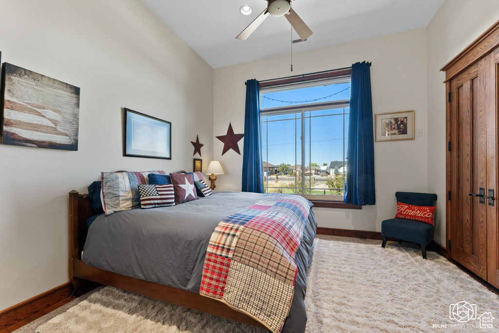 Bedroom featuring baseboards and ceiling fan