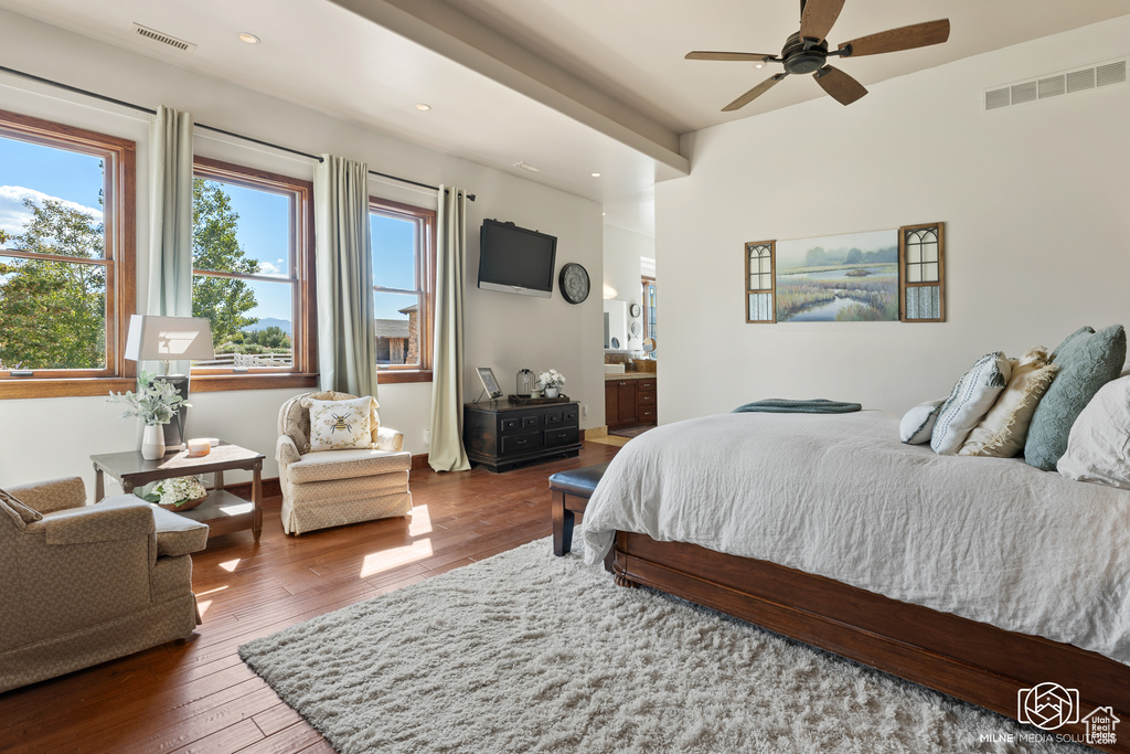 Bedroom with wood-type flooring, recessed lighting, ensuite bath, and ceiling fan