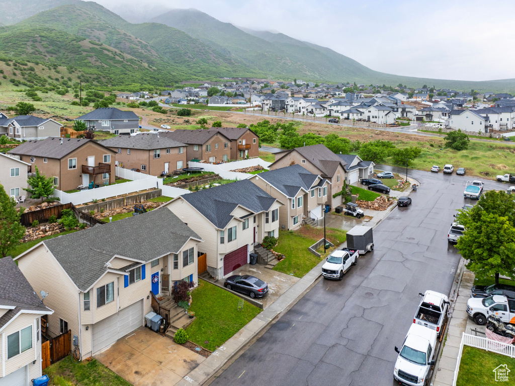 Aerial perspective of suburban area with a mountainous background