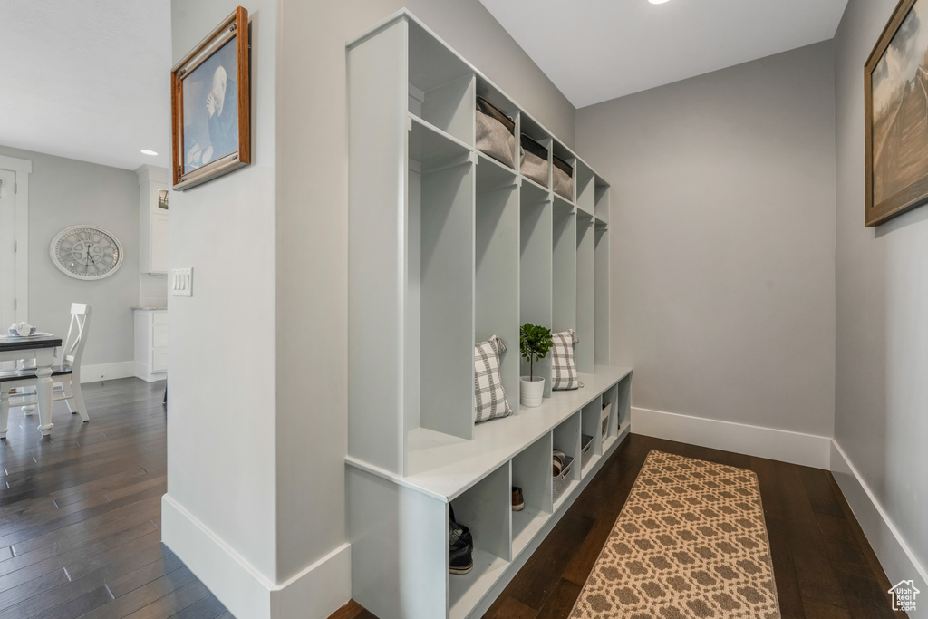 Mudroom featuring dark wood-style flooring, baseboards, and recessed lighting