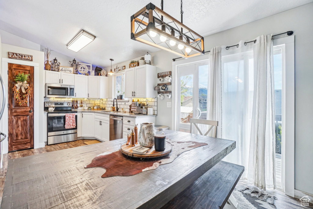 Dining area featuring light wood-style floors