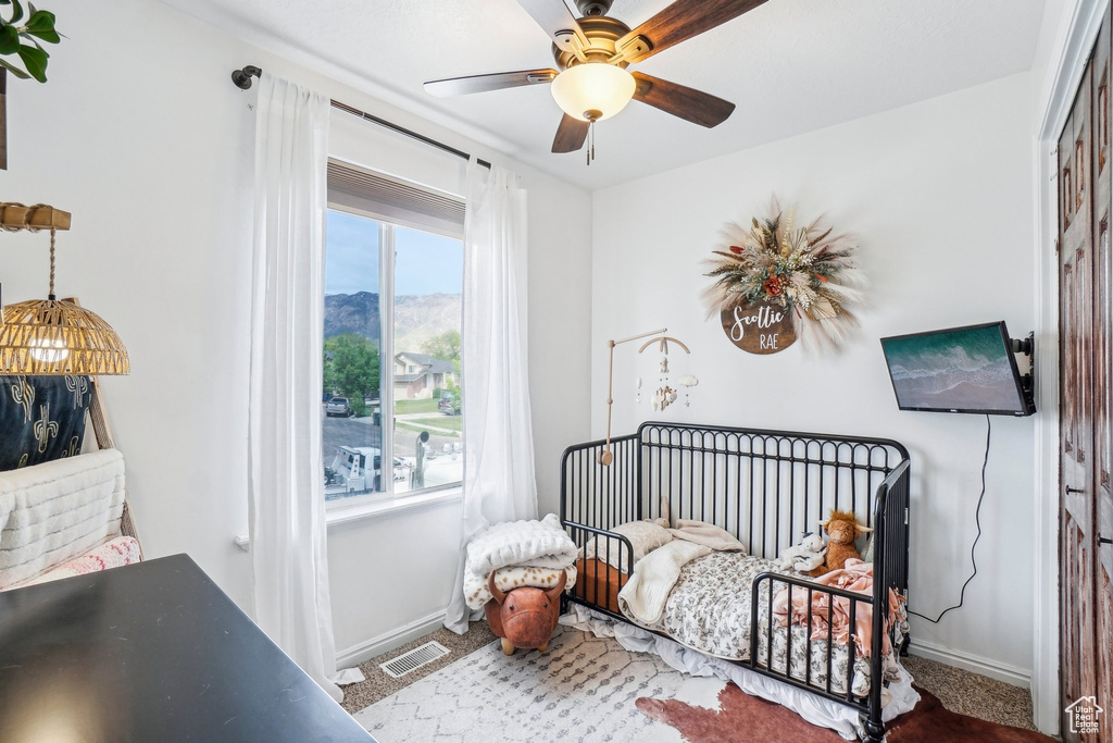 Bedroom featuring baseboards and a ceiling fan