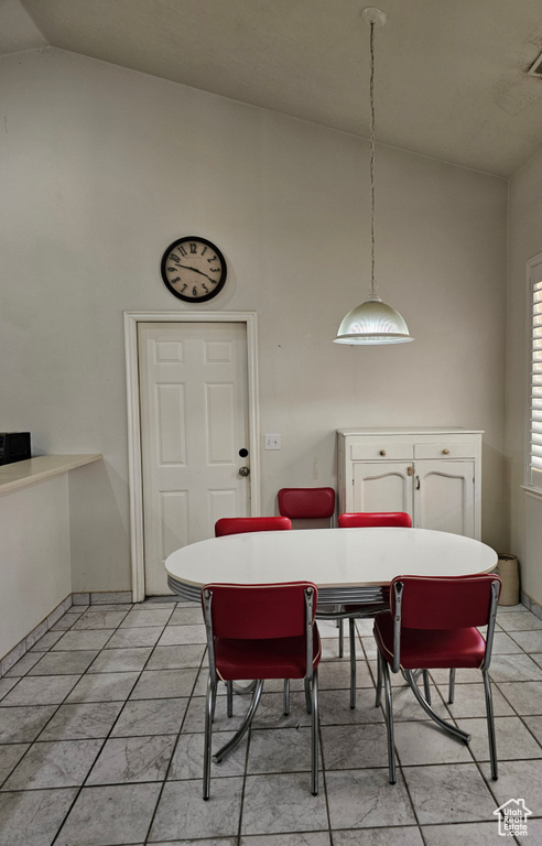 Dining room featuring high vaulted ceiling