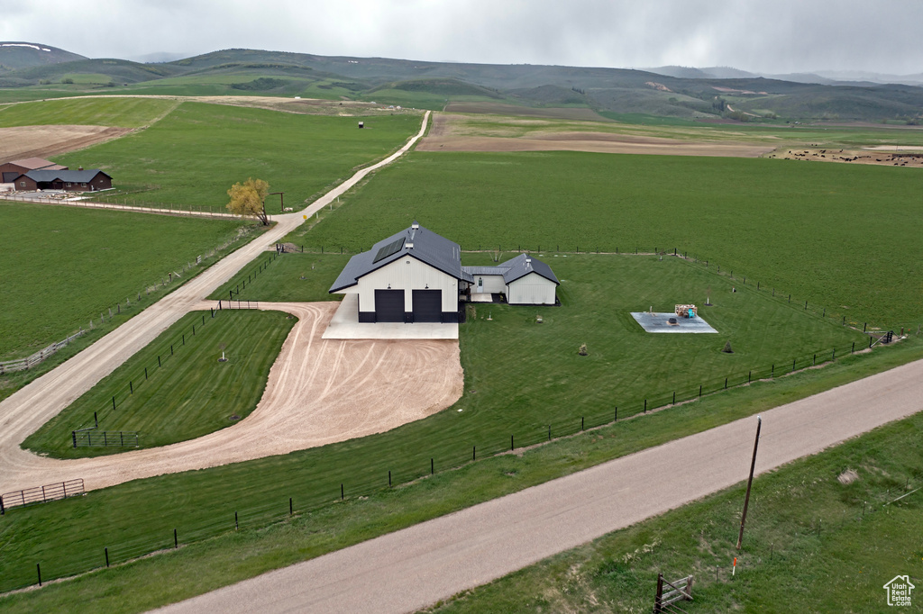 View of rural area with a mountainous background and a pastoral area