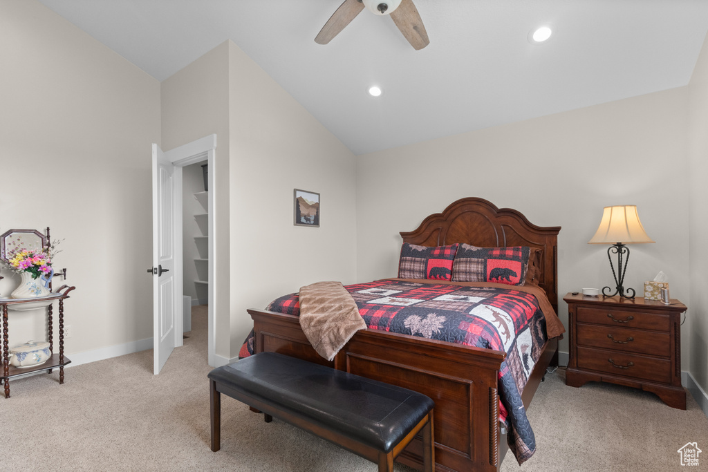 Carpeted bedroom with baseboards, vaulted ceiling, a ceiling fan, and recessed lighting