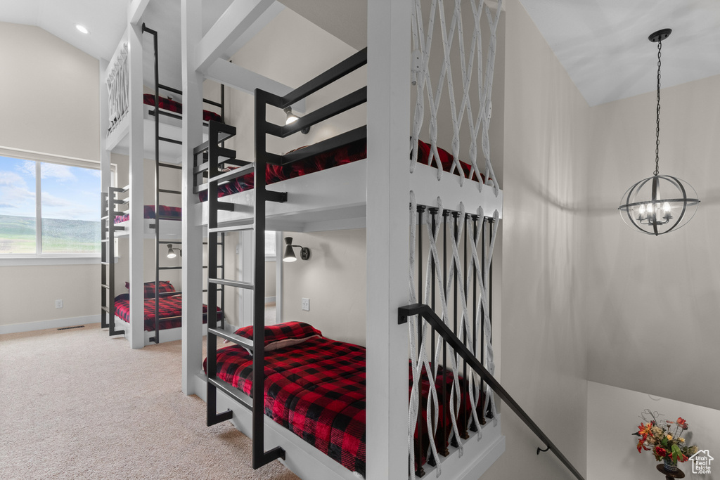 Bedroom featuring a chandelier, carpet floors, baseboards, and recessed lighting