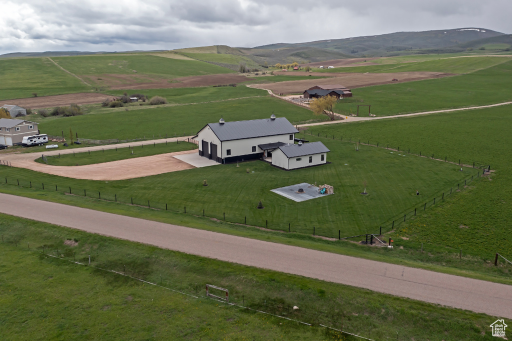 View of rural area featuring a pastoral area and a mountain backdrop