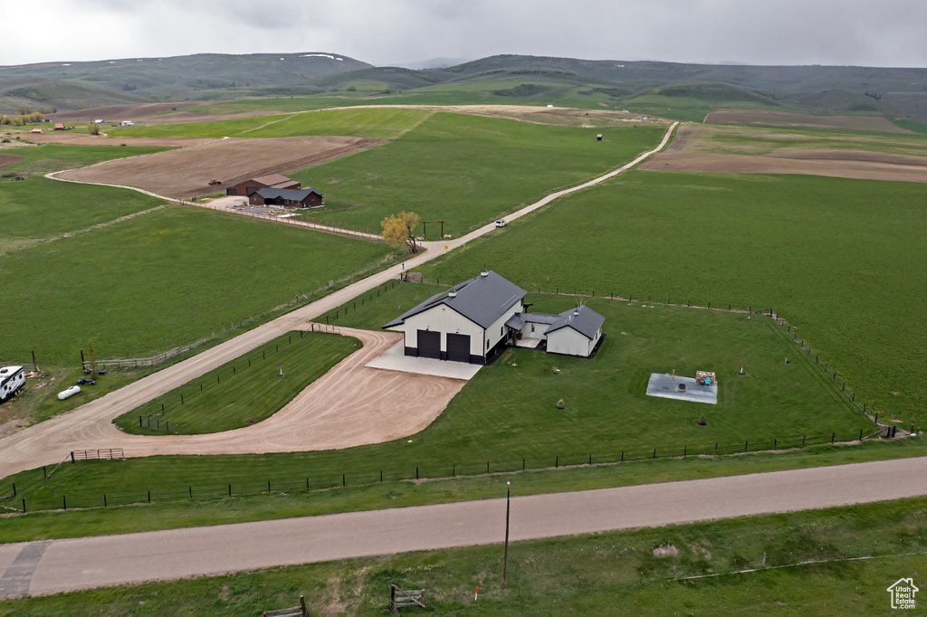 Aerial view of sparsely populated area featuring a mountain backdrop