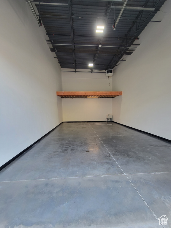 Garage featuring baseboards