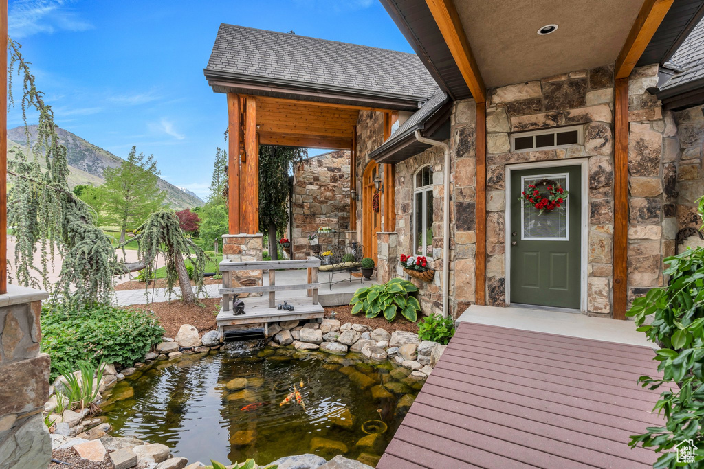 Dock area with a garden pond and a mountain view