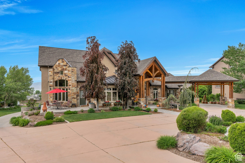 View of front facade featuring stone siding