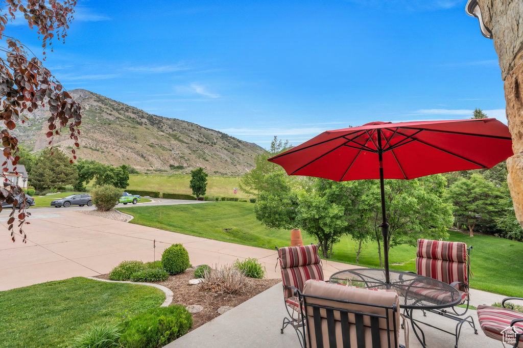 View of patio / terrace with a mountain view and outdoor dining space
