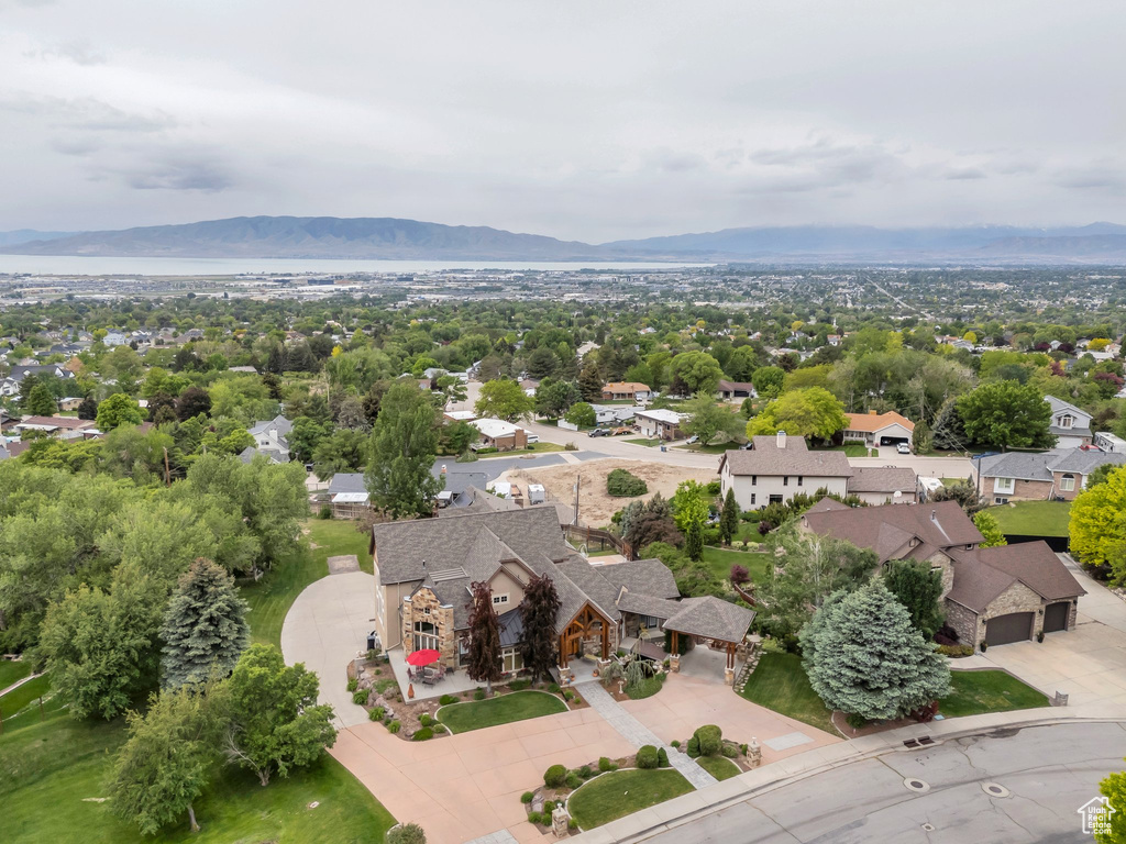 Aerial view of residential area featuring a mountain backdrop