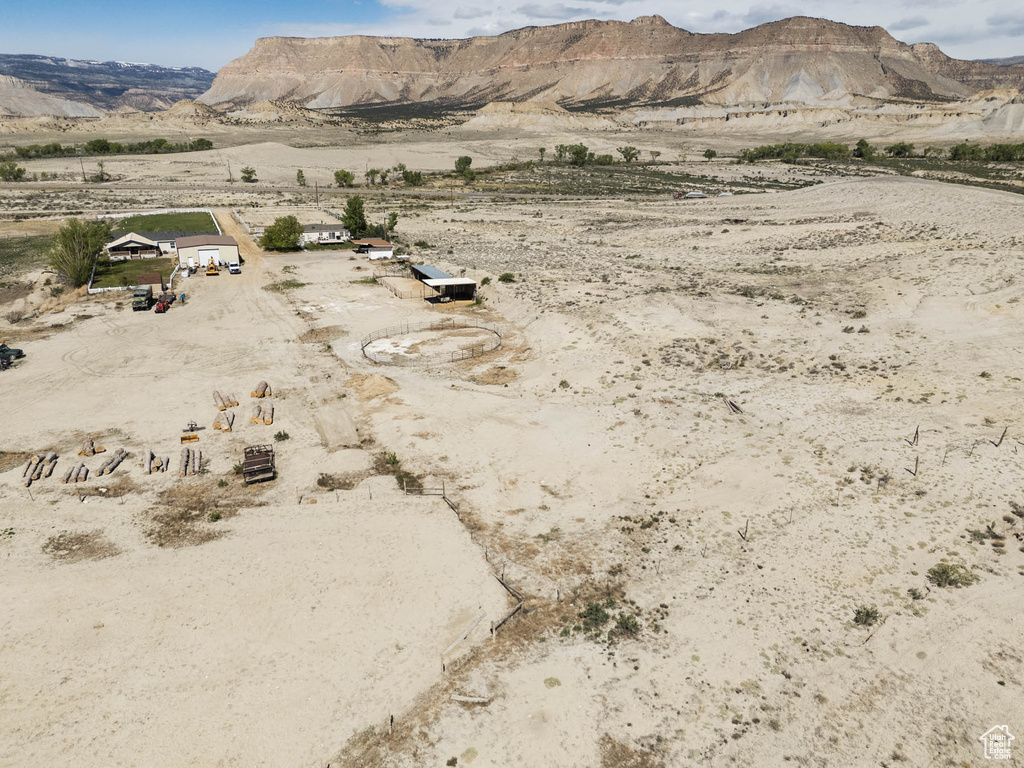 View of mountain backdrop with a desert landscape and rural landscape