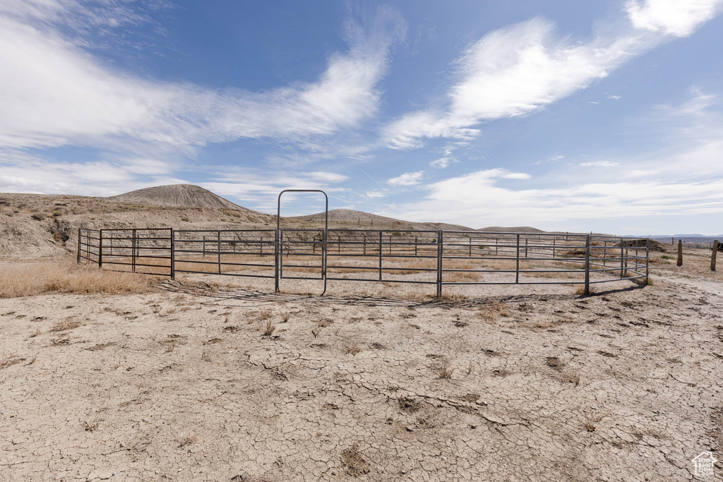 View of yard with a mountain view and fence
