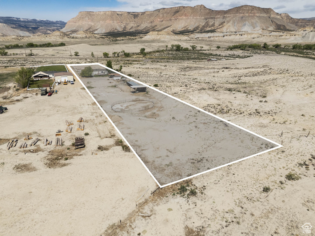 Overview of rural landscape with property boundaries highlighted, a desert landscape, and a mountainous background