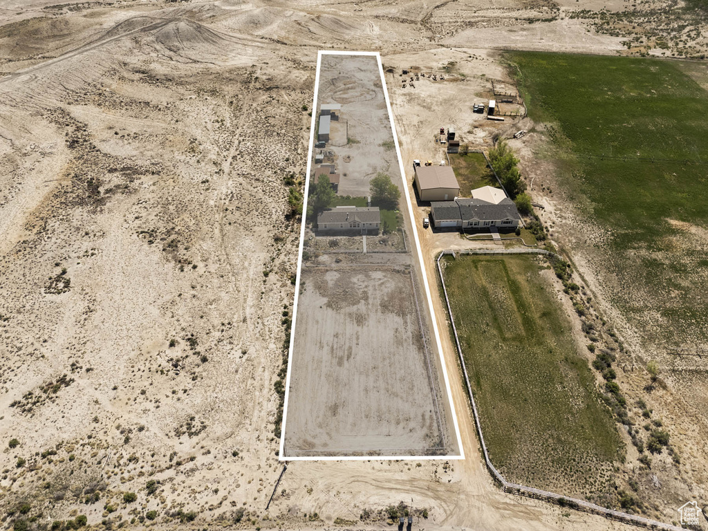 Aerial view of sparsely populated area featuring property parcel outlined and a desert landscape