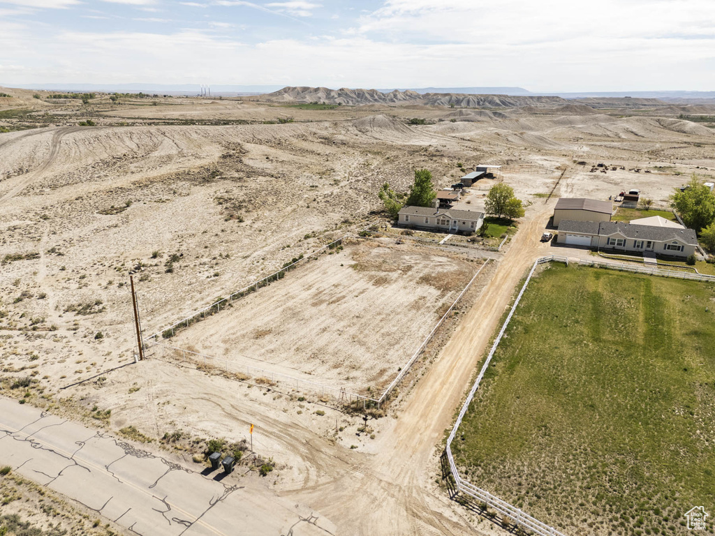 Aerial view of sparsely populated area featuring a mountain backdrop
