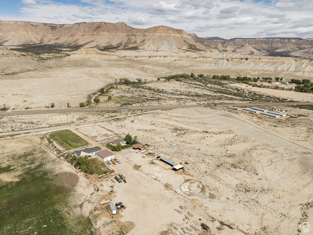 View of rural area featuring a desert landscape and a mountainous background