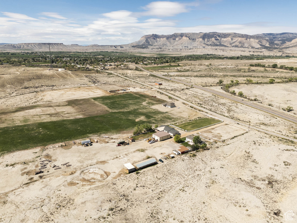 View of rural area featuring mountains and a desert landscape