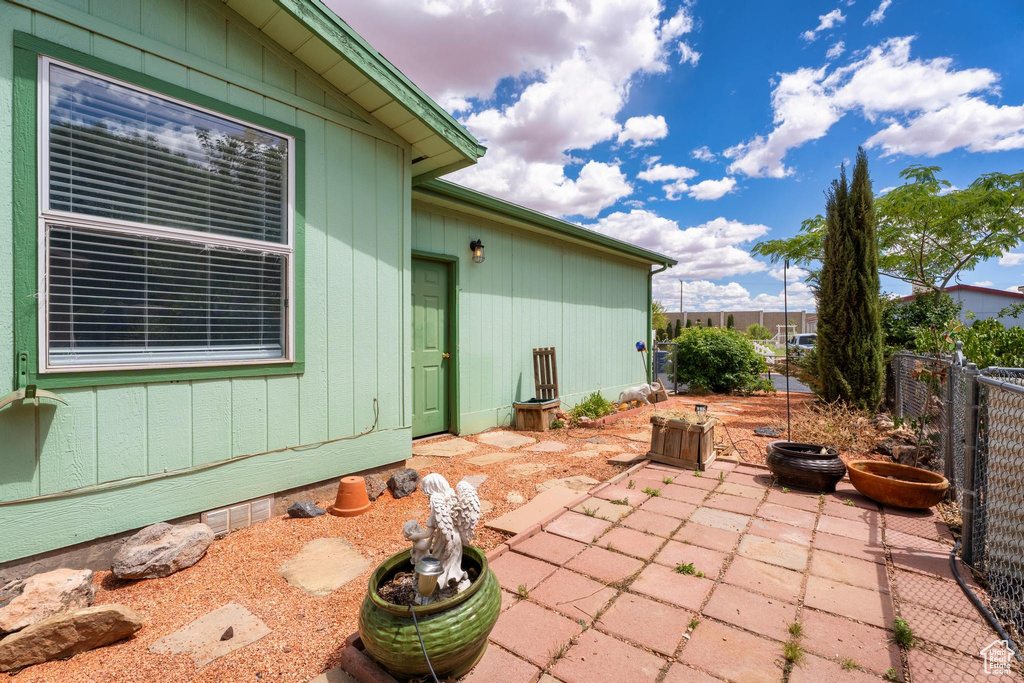 View of patio with fence