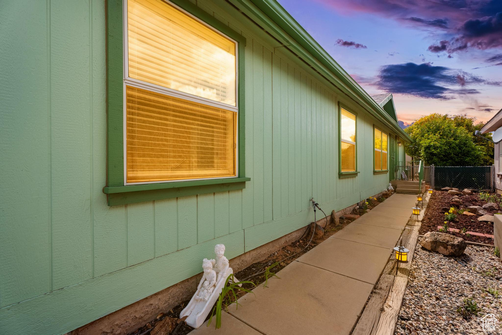 Property exterior at dusk with fence