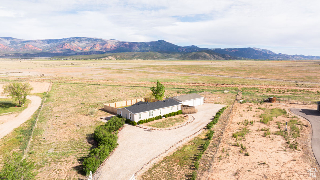 Aerial view of sparsely populated area with a mountainous background