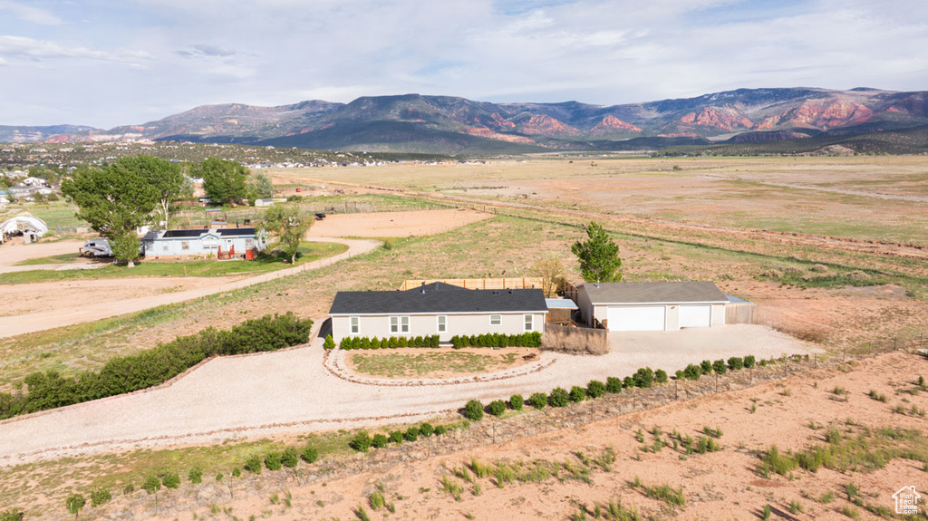 View of mountain backdrop featuring rural landscape