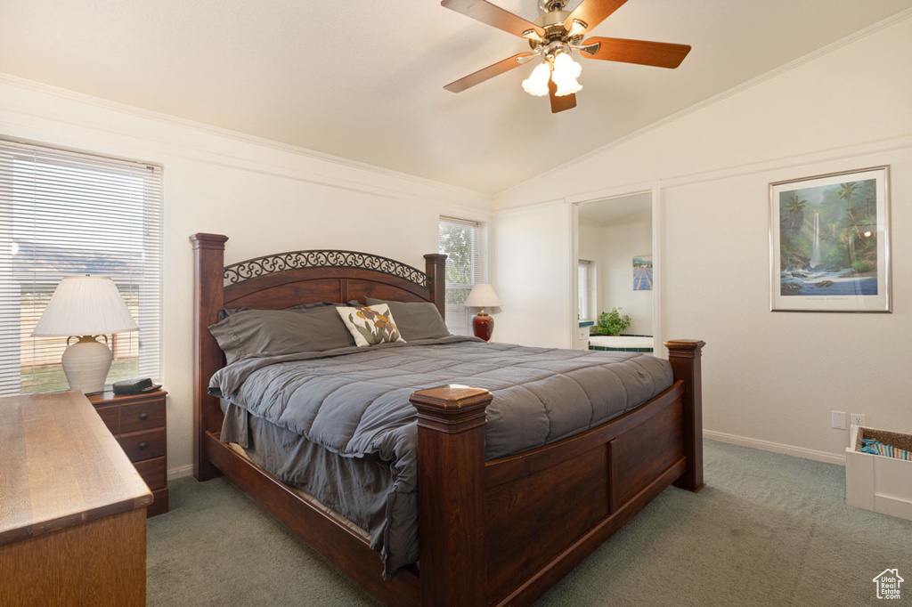 Bedroom featuring carpet floors, lofted ceiling, ceiling fan, and baseboards