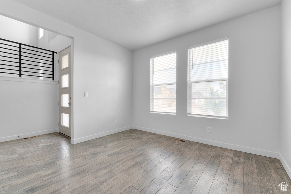 Empty room featuring light wood-style floors and baseboards