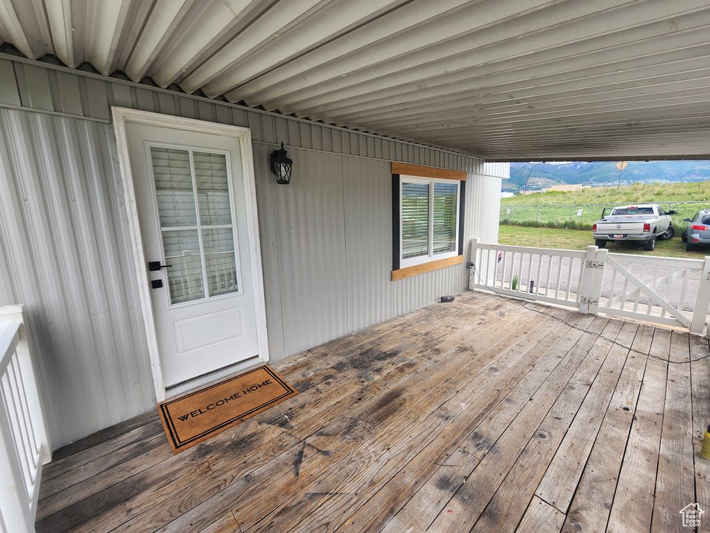 Wooden deck with a carport