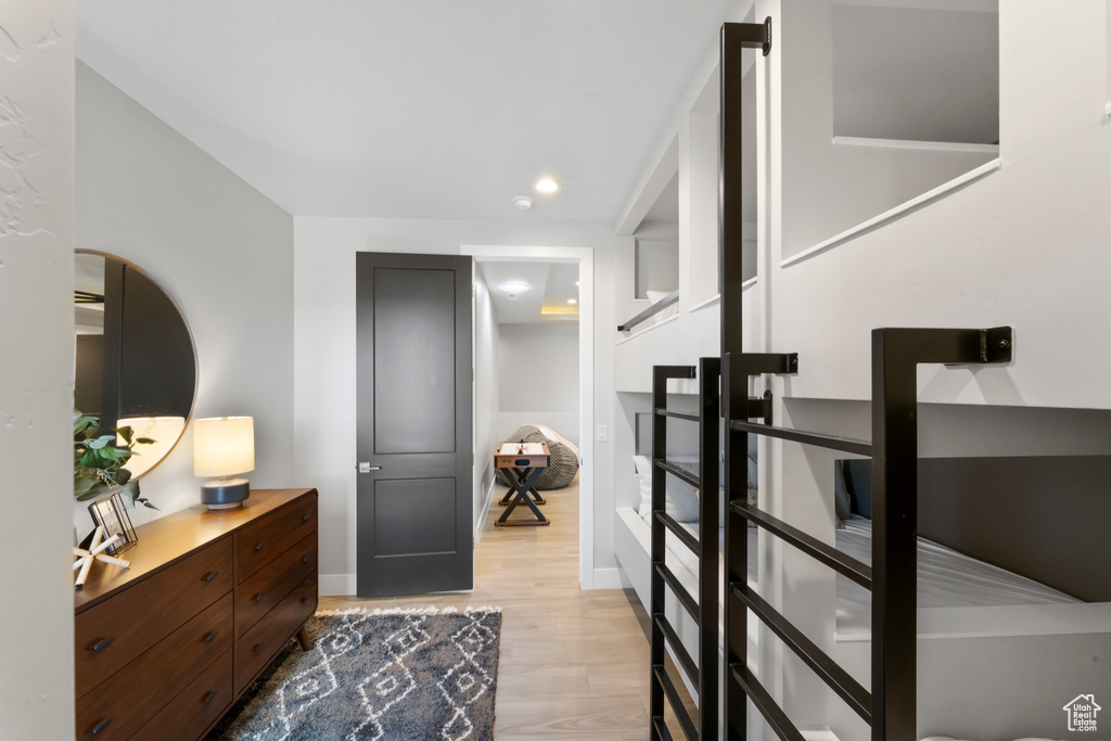 Foyer entrance with light wood finished floors, baseboards, and recessed lighting