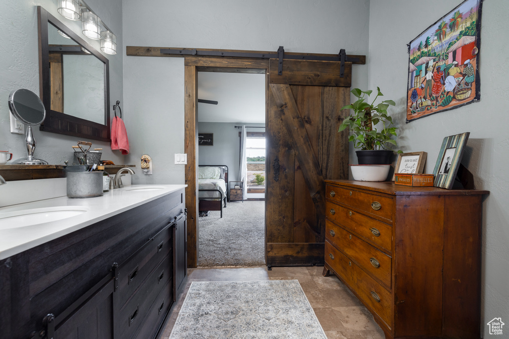 Ensuite bathroom featuring double vanity