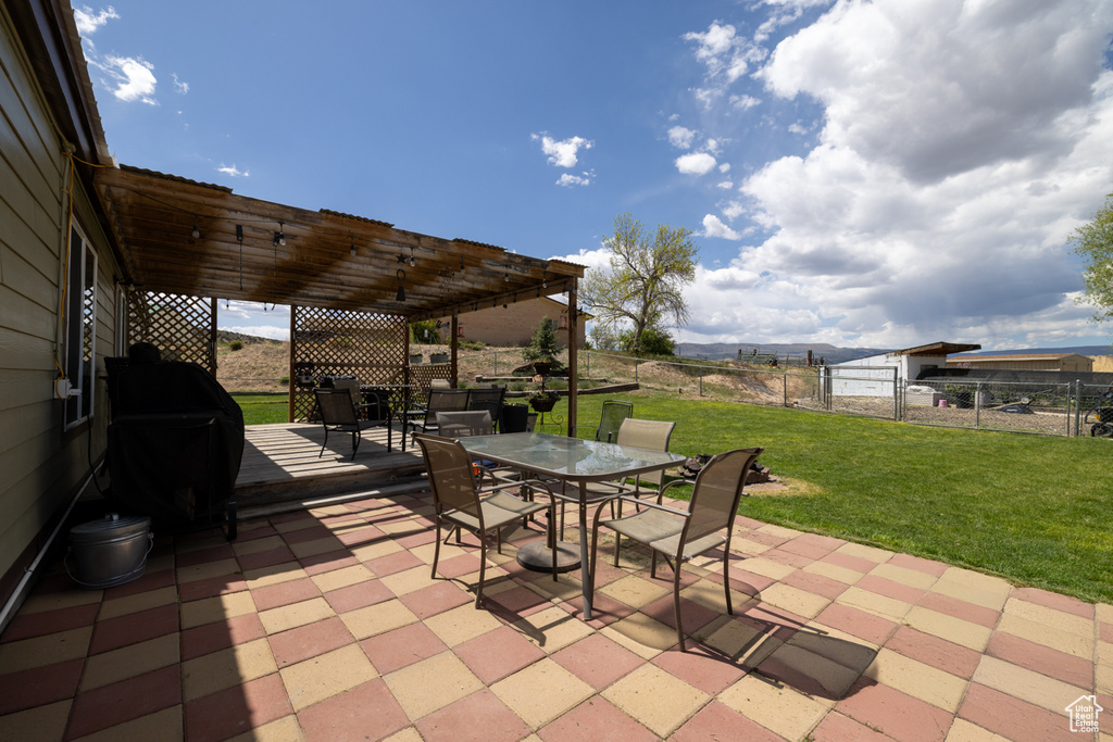 View of patio featuring outdoor dining space and a pergola