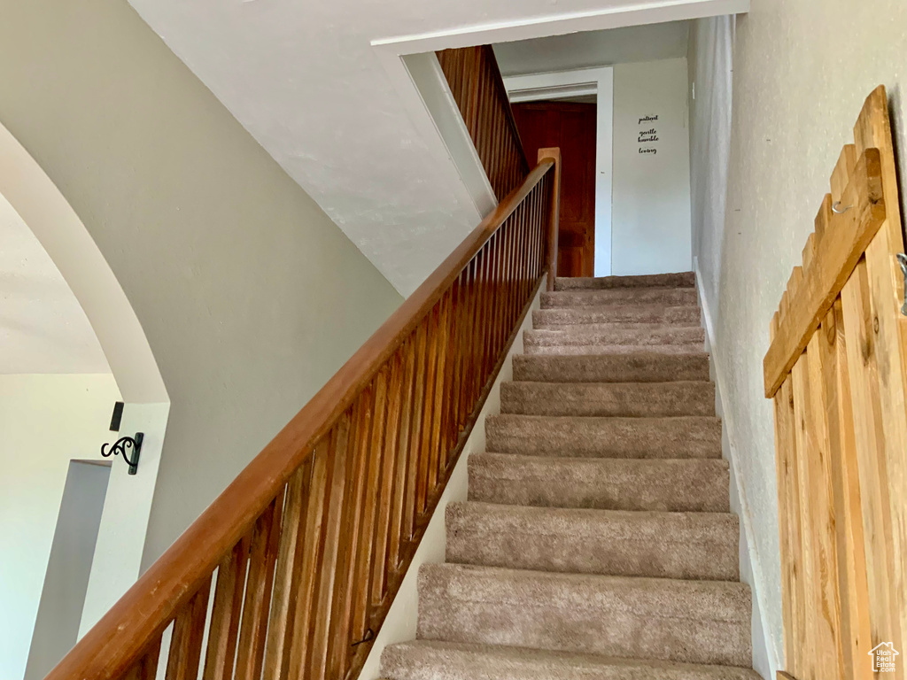 Stairs featuring arched walkways