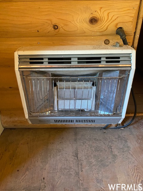 Detailed view of wood finished floors and heating unit