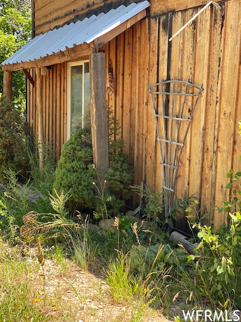 View of outdoor structure featuring fence