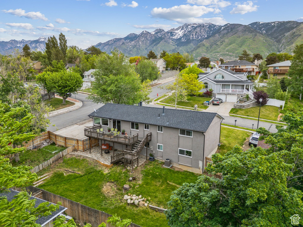 Aerial perspective of suburban area with a mountainous background