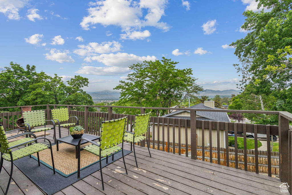 Wooden deck featuring a mountain view