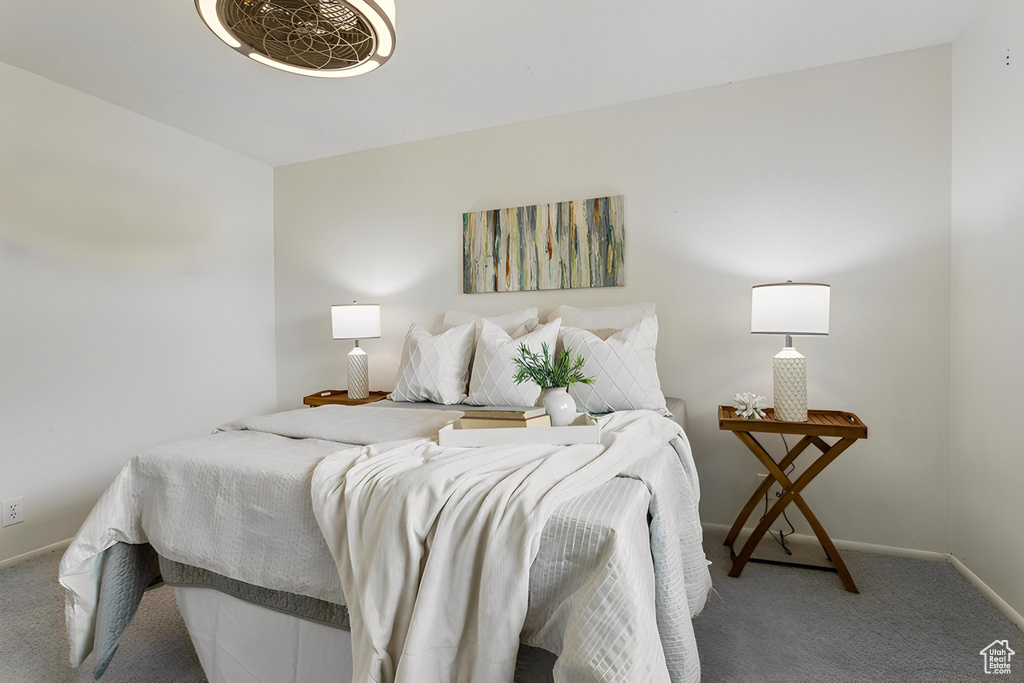 Carpeted bedroom featuring baseboards