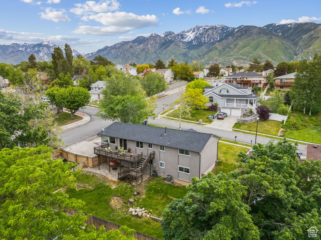 Aerial view of residential area with a mountainous background