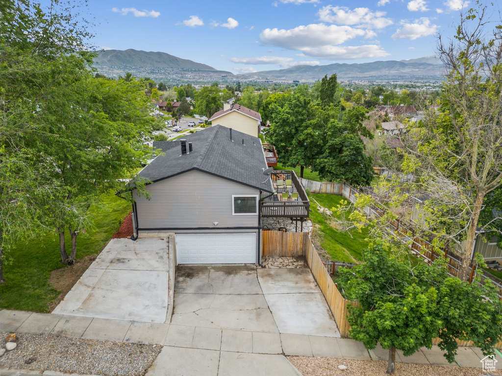 View of subject property with a mountain backdrop