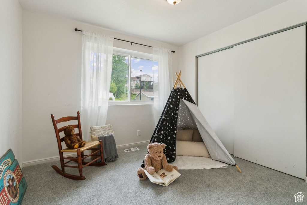Game room featuring carpet flooring and baseboards
