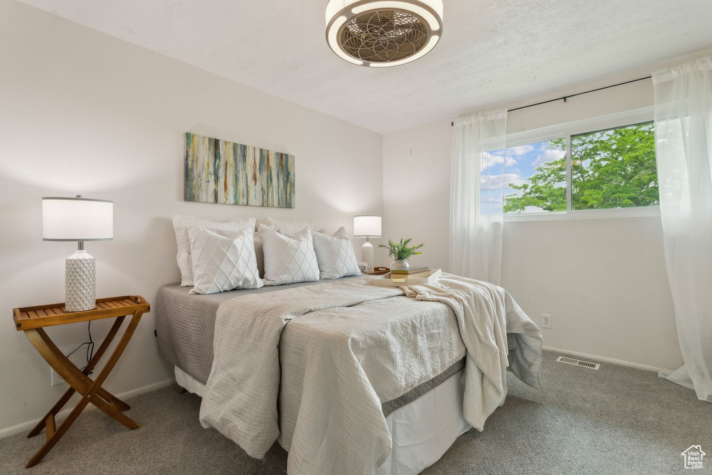 Bedroom with carpet and baseboards
