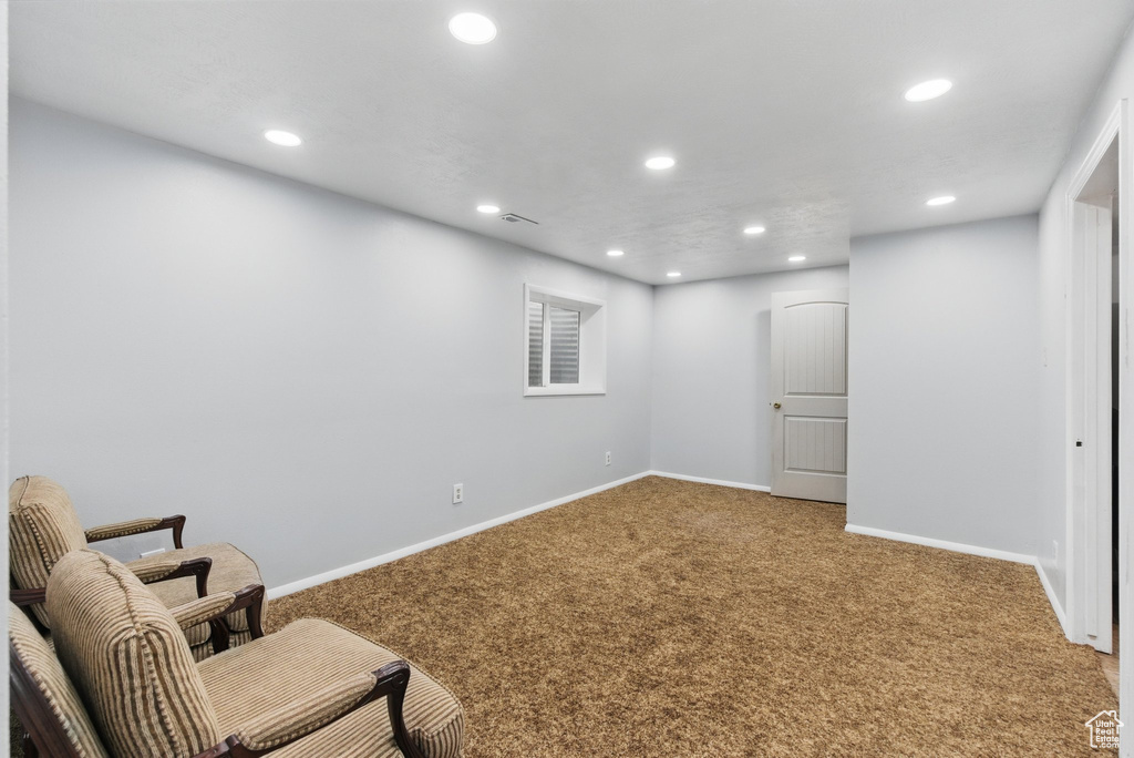 Sitting room with recessed lighting, carpet floors, and baseboards