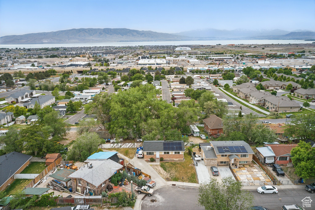 Aerial view of residential area featuring a mountain backdrop