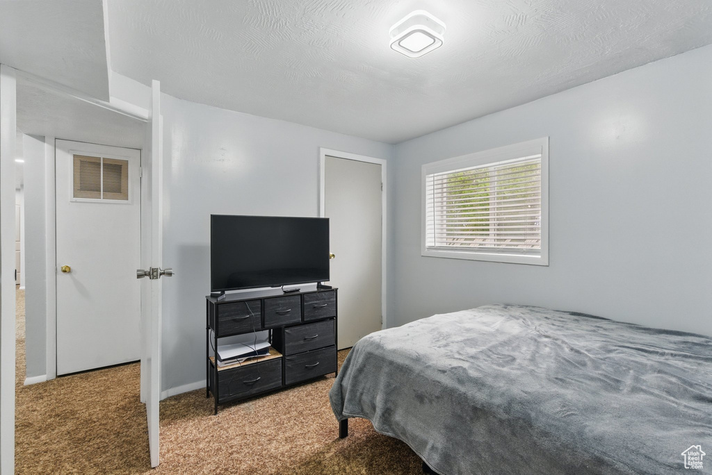 Bedroom featuring carpet flooring