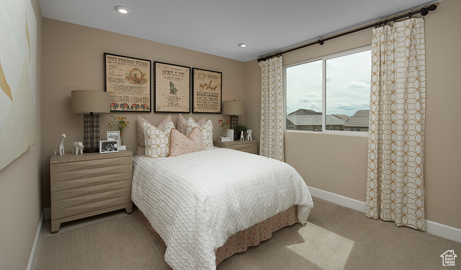Bedroom with carpet floors, baseboards, and recessed lighting