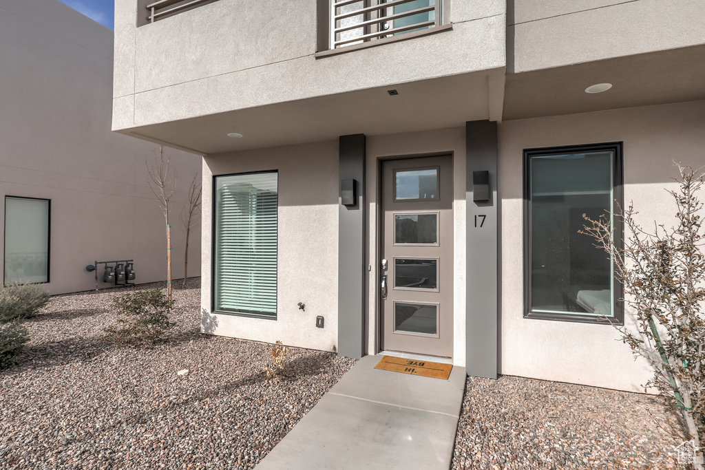 Doorway to property with stucco siding