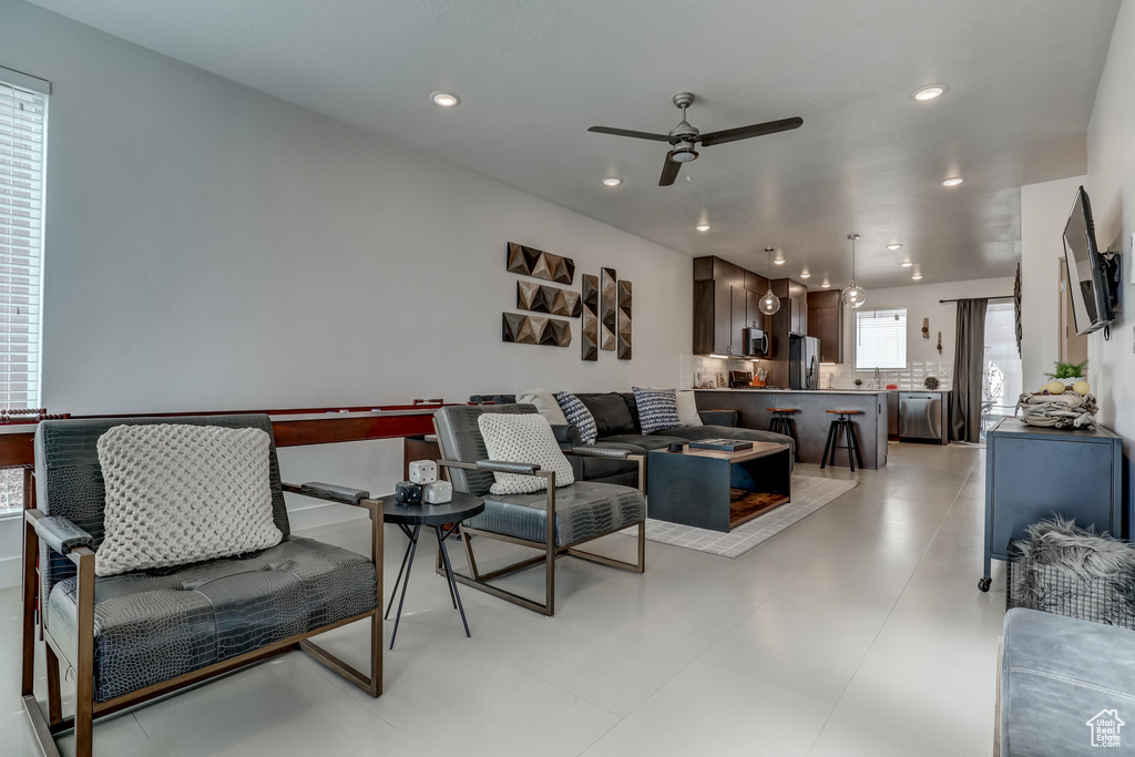 Living area featuring a ceiling fan and recessed lighting